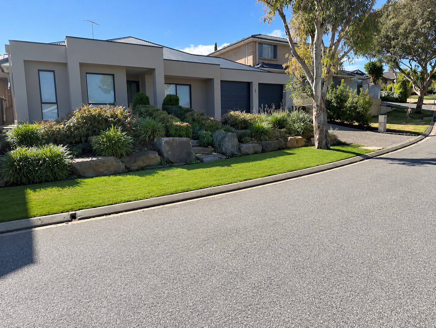 modern house frontage with clean lawn edging and neat shrubs